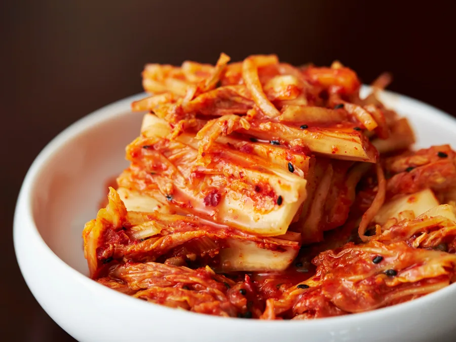 alt="Napa cabbage kimchi served on a plate"

