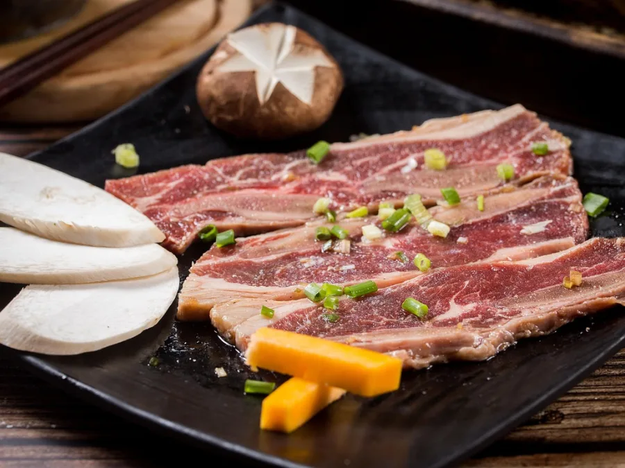 alt="Marinated short ribs ready for grilling"
