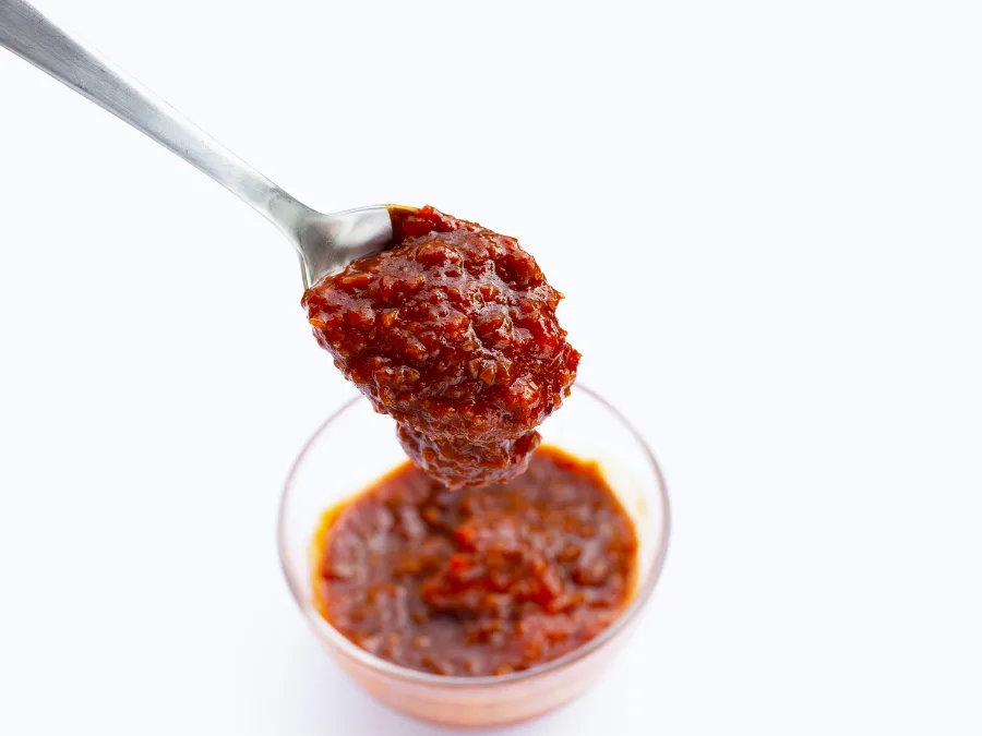 alt="A spoonful of ssamjang Korean bbq dipping sauce"
