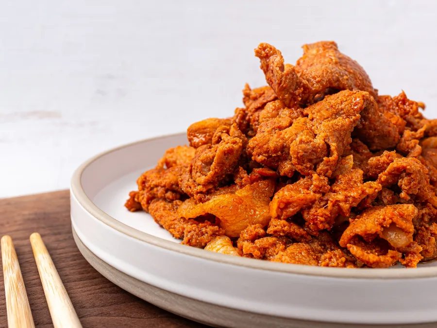 alt="Korean spicy stir-fried pork (Jeyuk Bokkeum) with gochujang sauce"