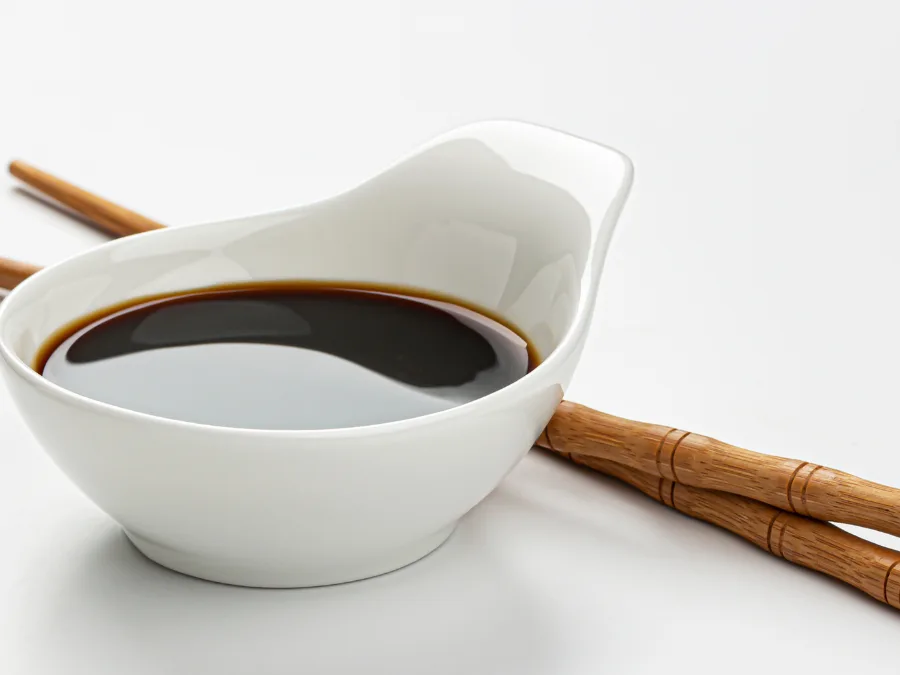 alt="Sesame soy dipping sauce in a small dish"